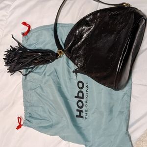 Hobo glossy black leather tears wristlet with fringe